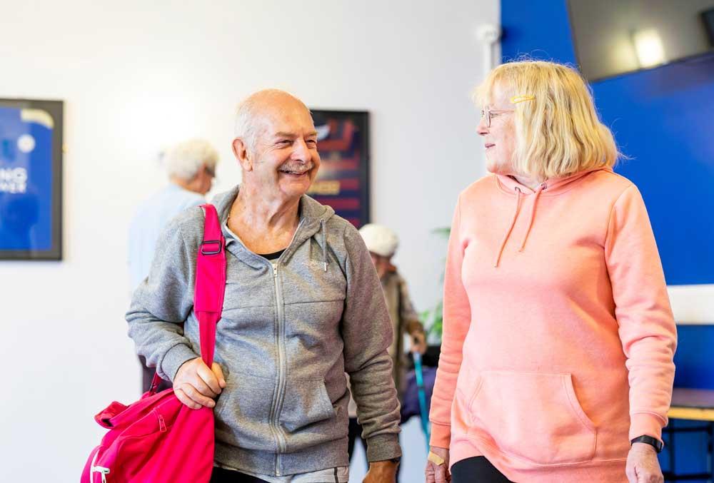 Image of 2 adults wearing gym clothes
