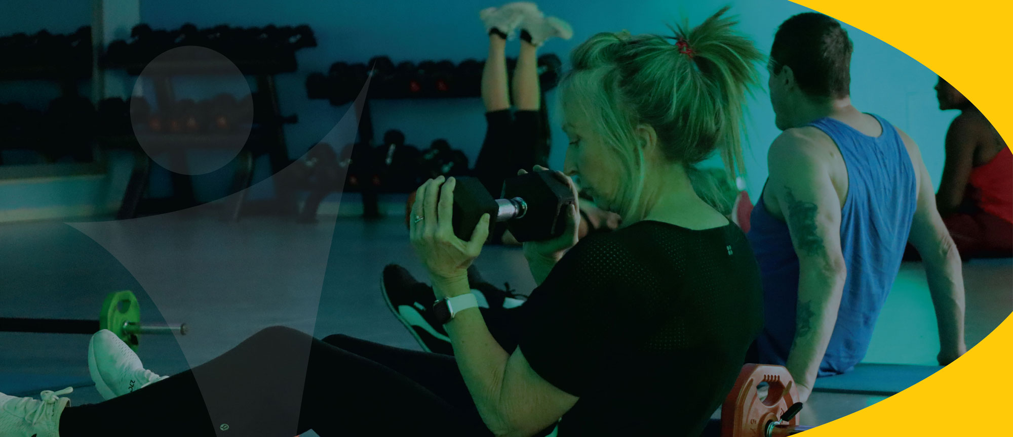 photo of woman using weights with yellow accent block